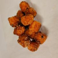 New Sweet tots  · Crispy fried sweet potato tots served with a side of maple syrup 