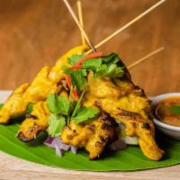 Satay Chicken (GF) · Grilled marinated chicken breast on skewers served with cucumber salad and peanut sauce.