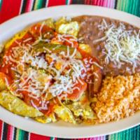 Chilaquiles · Cut up handmade crispy corn tortillas scrambled with eggs, cheese, and salsa ranchera. Serve...