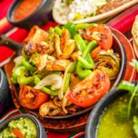 Chicken and Steak Mix Fajitas · Hot and fresh chicken and steak fajitas mixed with chopped onions, tomatoes, and bell pepper...