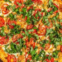 Margherita · White pizza with fresh tomato, basil and garlic.
