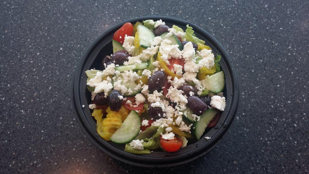 Meditteranian Salad · Romaine lettuce, cucumbers, Kalamata olives, feta cheese, vine-ripened tomatoes, and banana pepper rings served with Greek dressing.