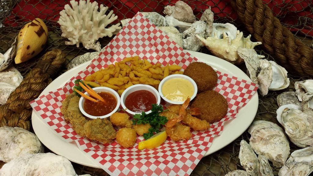 Seafood Sampler · Sea scallops, coconut shrimp, fried shrimp, crab cakes and jumbo clam strips. (No substitutions)