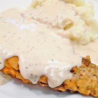 Chicken Fried Steak- Saturdays Only · Country fried steak with homemade mashed potatoes, gravy, and veggies.