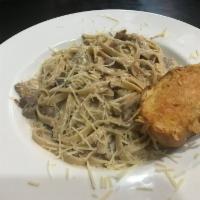 Fettuccine · Wide fettuccine. Tossed with our own Alfredo sauce and sprinkled with Parmesan. Add chicken,...