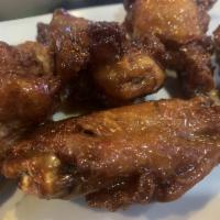 Wings · Jumbo chicken wings tossed in your favorite sauce and served with homemade blue cheese
or ra...