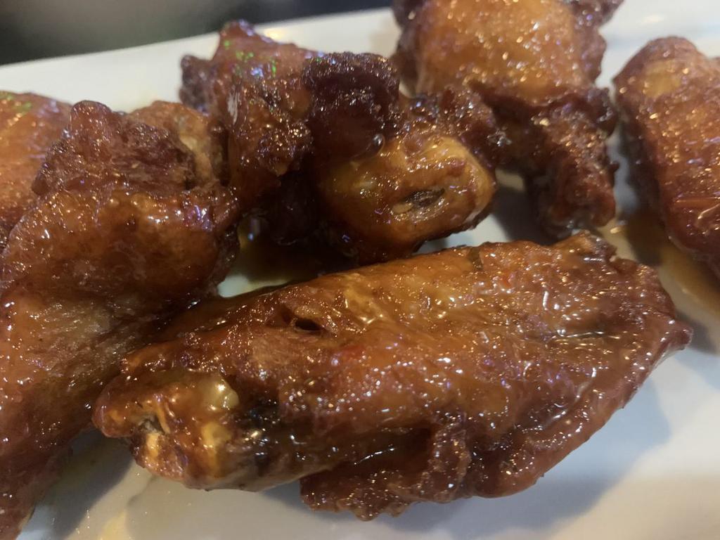 Wings · Jumbo chicken wings tossed in your favorite sauce and served with homemade blue cheese
or ranch dressing.