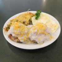 Country Sandwich & eggs · Two sausage biscuits with country gravy on top & cheese. Served with two eggs your way and a...