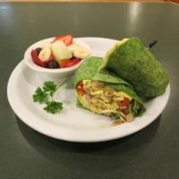 Breakfast Burrito · Sausage, eggs, bell pepper, onions, tomatoes and cheese and your choice of tortilla.