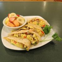 Breakfast Quesadilla · Sausage, eggs, bell pepper, onions, tomatoes and cheese and your choice of tortilla.