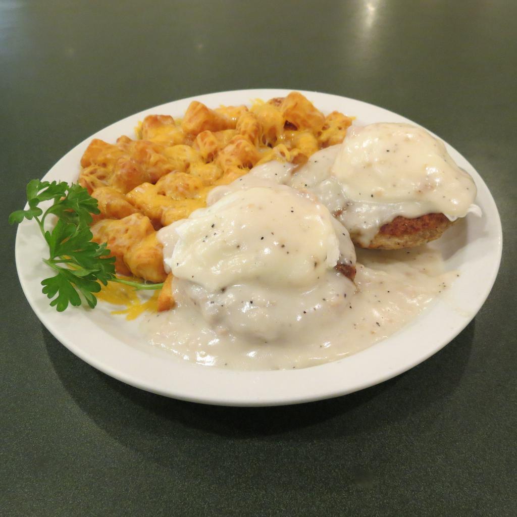 Sausage Benedict · Grilled sausage patties and poached eggs atop a buttermilk biscuit and topped with sausage gravy.