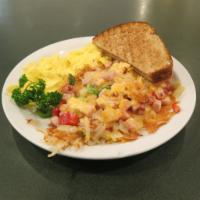 Grand Day Meal · Ham, onions, bell pepper, cheese on hashbrowns, 2 eggs and toast.