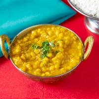 Yellow Dal · Bright yellow lentils with green onions, fresh tomatoes and spices. Served with saffron and ...