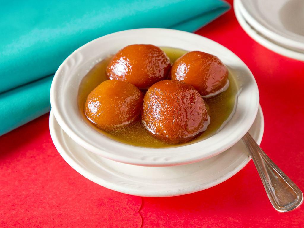 Gulab Jamun · 2 pieces. Dry milk and homemade cheese balls, deep fried, in a light syrup and rose water. Served warm.