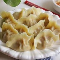Pork Boiled Dumplings 猪肉水饺 · Eight Pieces.