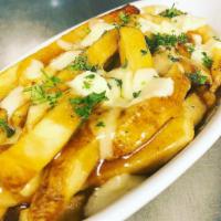 Wisconsin Disco Fries · Wisconsin white cheddar cheese curds, brown gravy and french fries. Gluten free.