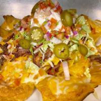 Nachos · Beef chili, Jack cheddar, lettuce, jalapenos, pico de gallo, sour cream and corn tortilla ch...