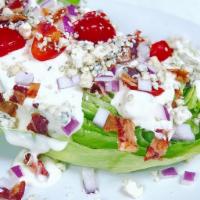Wedge Salad · Iceberg, tomato, red onion, smoked bacon, blue cheese crumbles and blue cheese dressing. Glu...