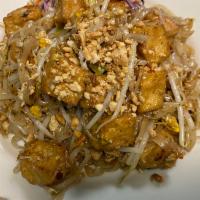 PT3. Spicy Tofu Pad Thai · Stir-fried fresh rice noodles with tofu, bean sprouts, egg, scallion and ground peanuts.