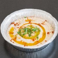 Hummus · Chick peas, tahini, garlic and olive oil.