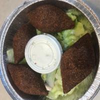 4 Piece Kibbeh · Fried ground meat and burghul shell stuffed with ground meat, onions .