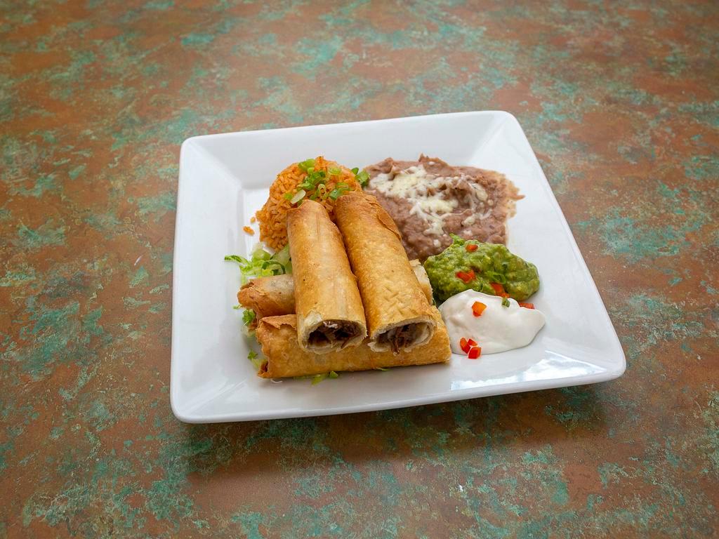Flautas de Toto · 2 flour tortillas rolled, 1 with beef and cheese, 1 chicken and cheese, deep fried, garnished with guacamole and sour cream.