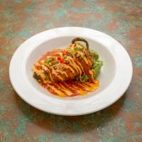 Pescado Relleno · Cod stuffed with shrimp and crab meat, topped with a spicy cream sauce. Served with rice and...