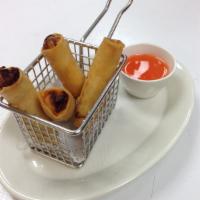 Vegetable Spring Rolls · Served with pineapple and carrot sauce.