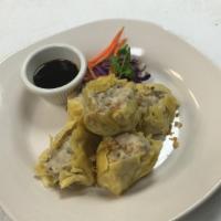 Nabon Dumplings · Steamed chicken and shrimp dumplings with sweet soy sauce.