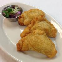 Chicken Curry Puff ·  Served with cucumber salad.