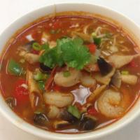 Tom Yum Noodle Soup · Rice noodle with chicken or shrimp in hot and sour soup. Hot and spicy.