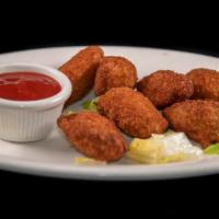 Jalapeno Poppers · 6 pieces. Cream cheese-filled jalapenos served with marinara sauce.