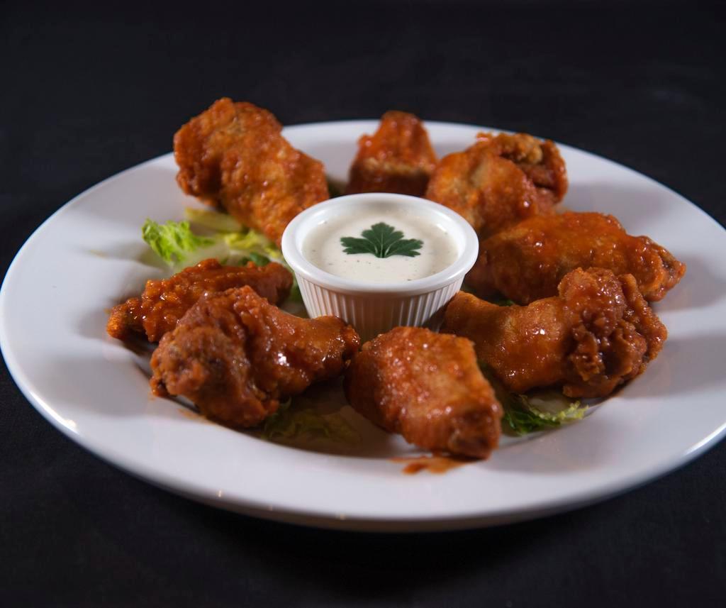 Di Bufala Wings · 8 pieces. Homemade jumbo chicken wings tossed with your choice of sauce and served with ranch dressing.