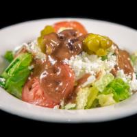 Greek Salad · Lettuce, tomatoes, cucumber, Kalamata olives, feta, pepperoncini, and vinaigrette dressing.

