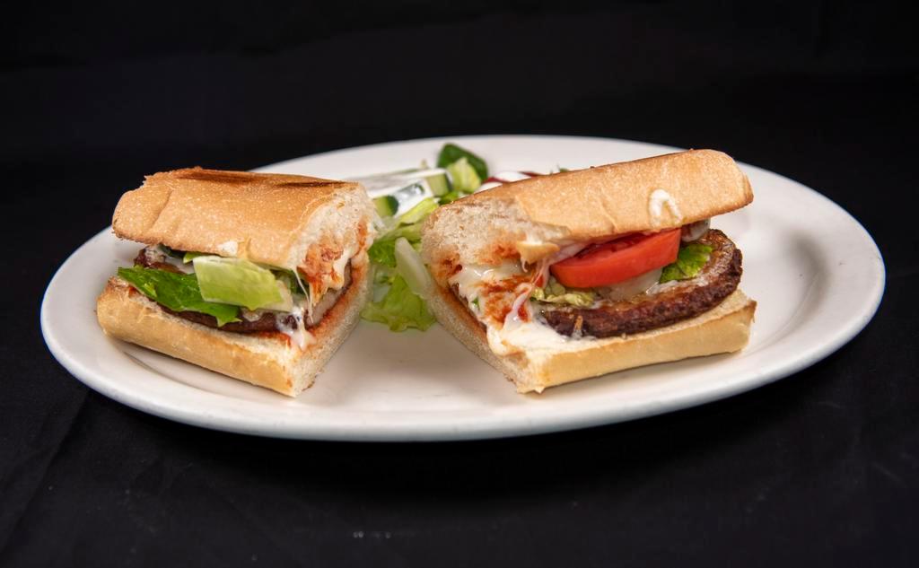 Italian Sausage Sandwich · Fresh Italian sausage topped with mozzarella cheese and fresh tomatoes and lettuce.  Served on soft French bread with tomato sauce.