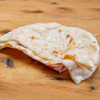 Cheese Naan · Naan stuffed with cheddar cheese with butter brushed on top cheesy bread.