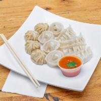 Momo Chicken · Steamed dumplings even our grandmothers in Nepal would be proud of.