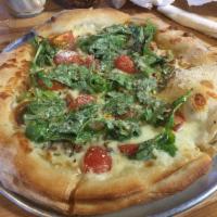 BLT Pizza · A lite pizza with bourbon bacon, heirloom tomatoes, baby arugula all on a 4 blend cheese and...