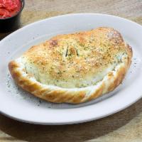 Classic Calzone · Pepperoni, Canadian bacon and sausage.