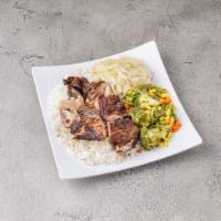 Jerk Chicken Dinner · Charcoal grilled with authentic Jamaican jerk spices. Served with white rice, yellow rice or...