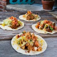 3 Tacos  · 3 soft flour or corn tortillas filled with your choice of chicken, ground beef, carnitas, or...