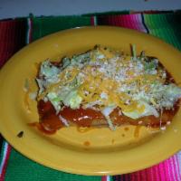 2 Cheese Enchiladas · Two enchiladas stuffed with cheddar cheese, topped with enchilada sauce, lettuce, and both c...