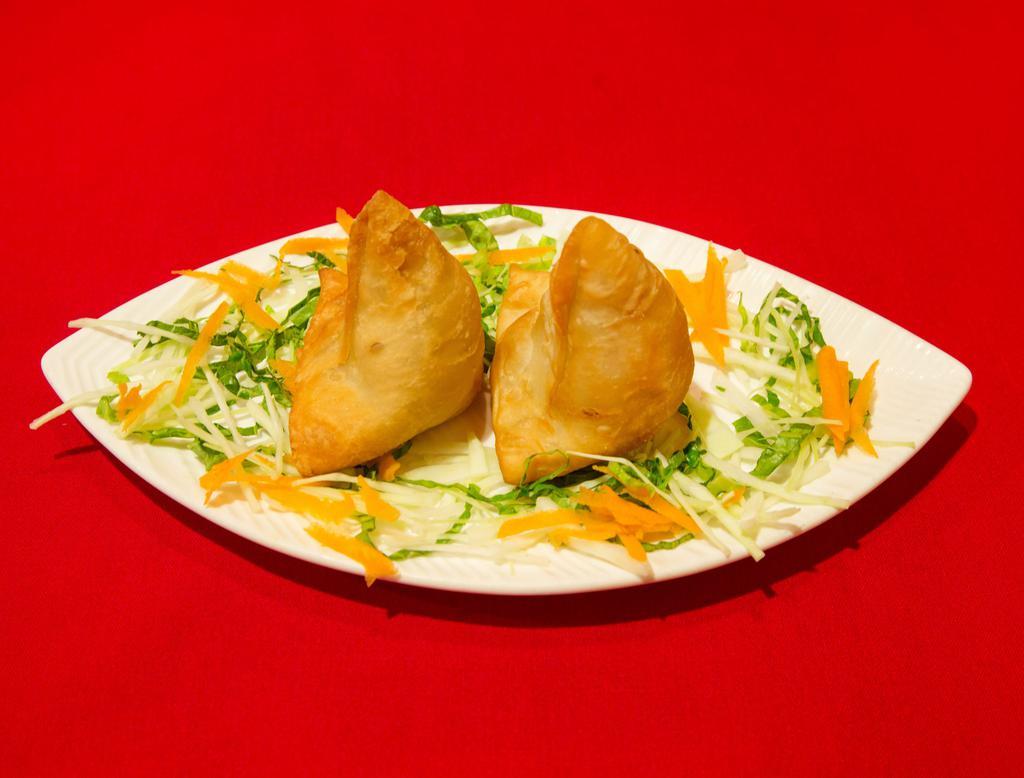 1. Vegetable Samosa · Crispy turnover, filled with mildly spiced potatoes and green peas.
