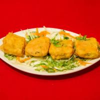 3. Paneer Pakora · Homemade Indian cheese square, batter dipped, fried till golden and served with chutney.