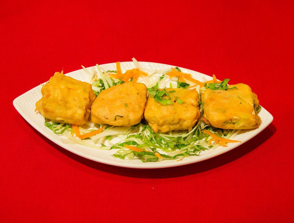 3. Paneer Pakora · Homemade Indian cheese square, batter dipped, fried till golden and served with chutney.