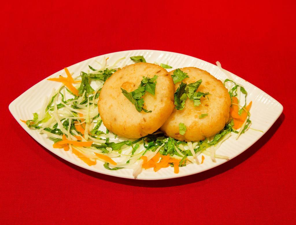 6. Tawa Tikki · Crisp potato patties and shallow fries with mild spices.