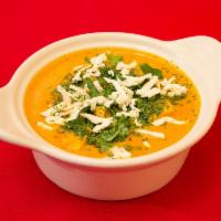 14. Paneer Makhani · Homemade Indian cheese cooked in creamy tomato sauce.