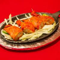 2. Tandoori Chicken · Chicken marinated in yogurt and fresh mild spices and roasted over charcoal in the tandoor.
