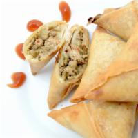Chicken Samosa · 2 piece. Delectable Indian pastry turnover crispy outside filled with ground chicken with sp...