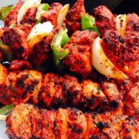 Chicken Tikka Kabab · Boneless chicken breast marinated with special spice mix and slowly cooked in the clay oven ...